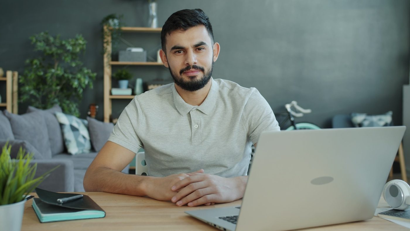 A professional at a desk with a laptop