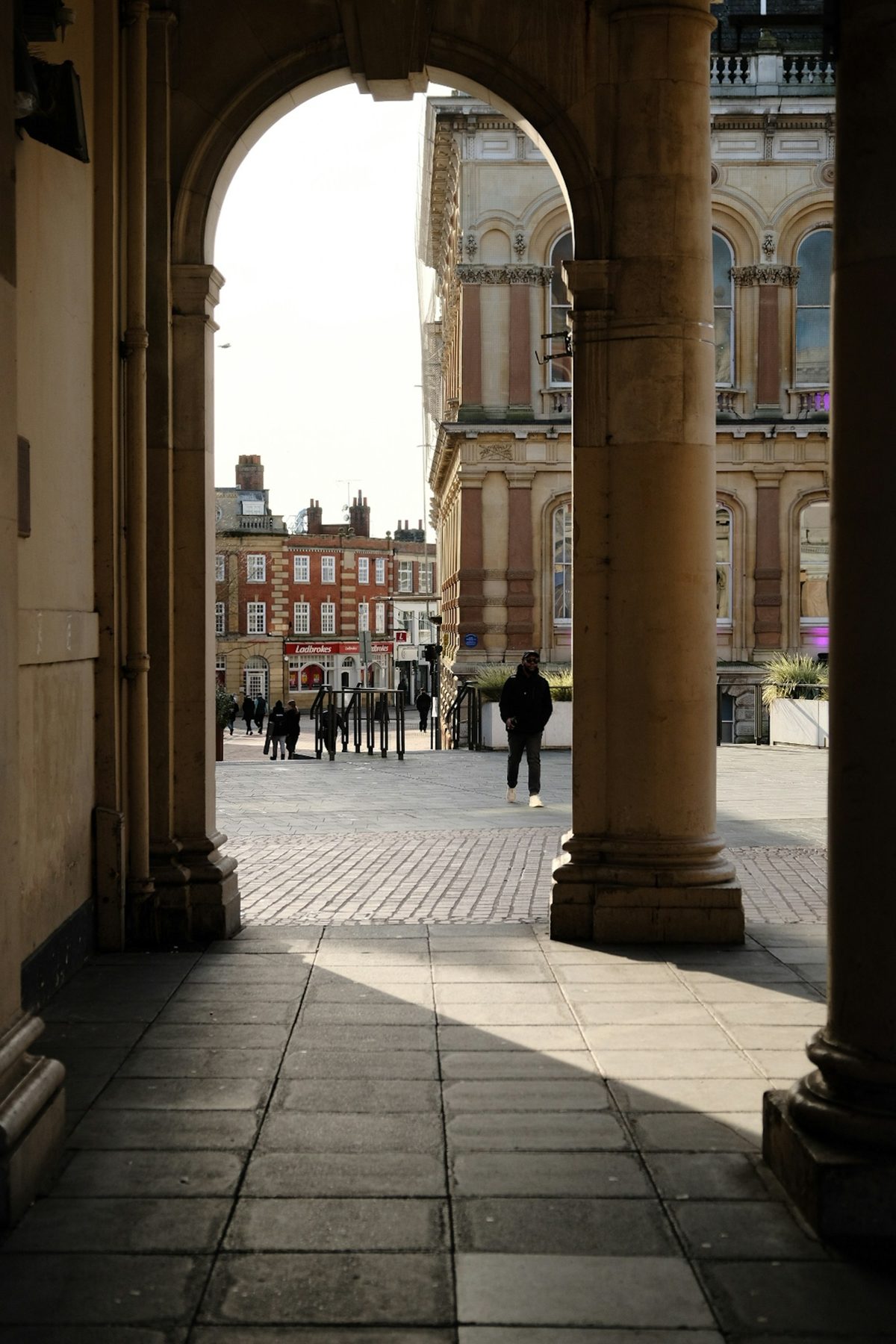 An archway opening onto a UK town square