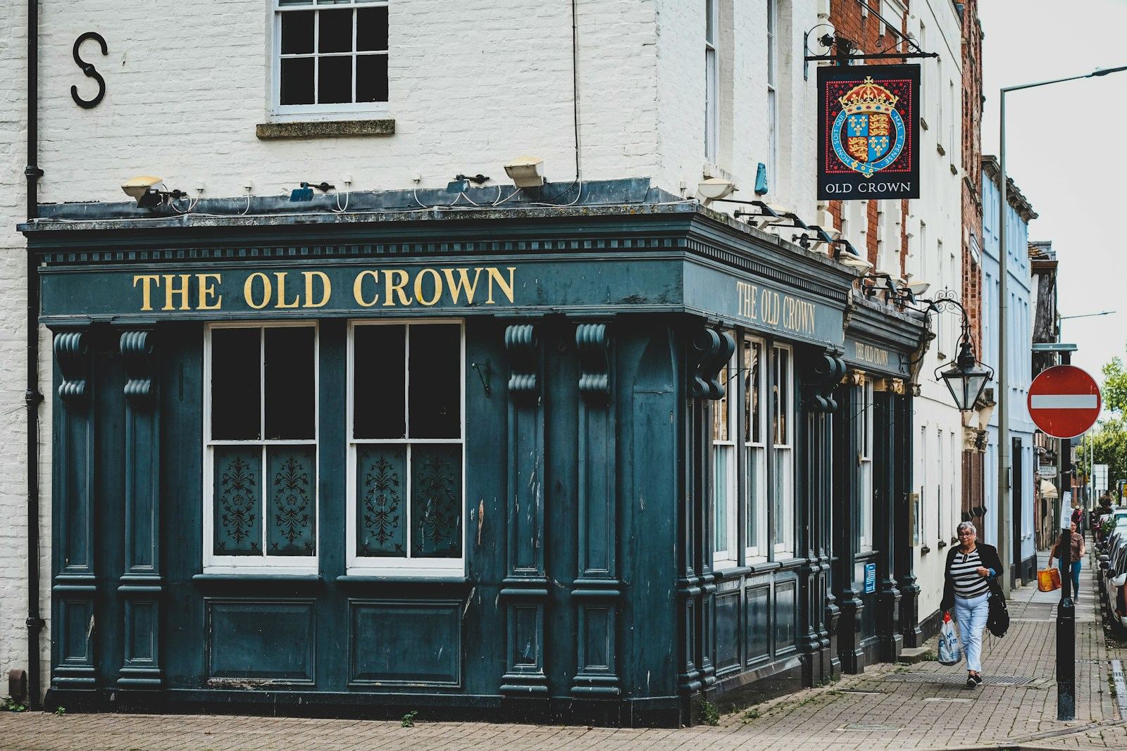 The front of a traditional British pub on a street corner