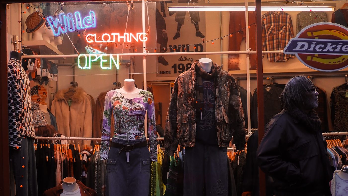 A clothes shop window with an open sign